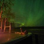Nordlichter vom Jacuzzi aus beobachten © Lapland Guesthouse